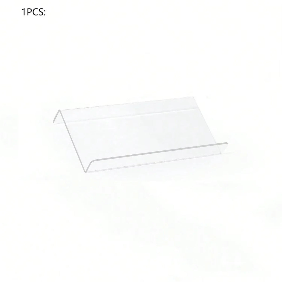 Adjustable acrylic spice organizer tray inside an open kitchen drawer holding spice jars at an angle.