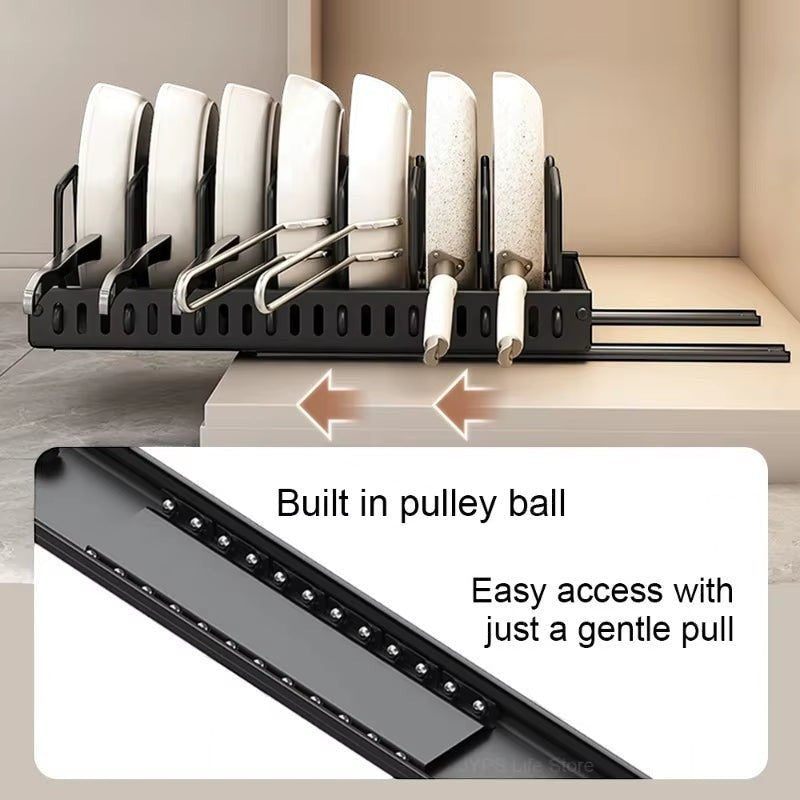Pull-out cabinet organizer holding pots, pans, and lids upright in a kitchen cabinet.