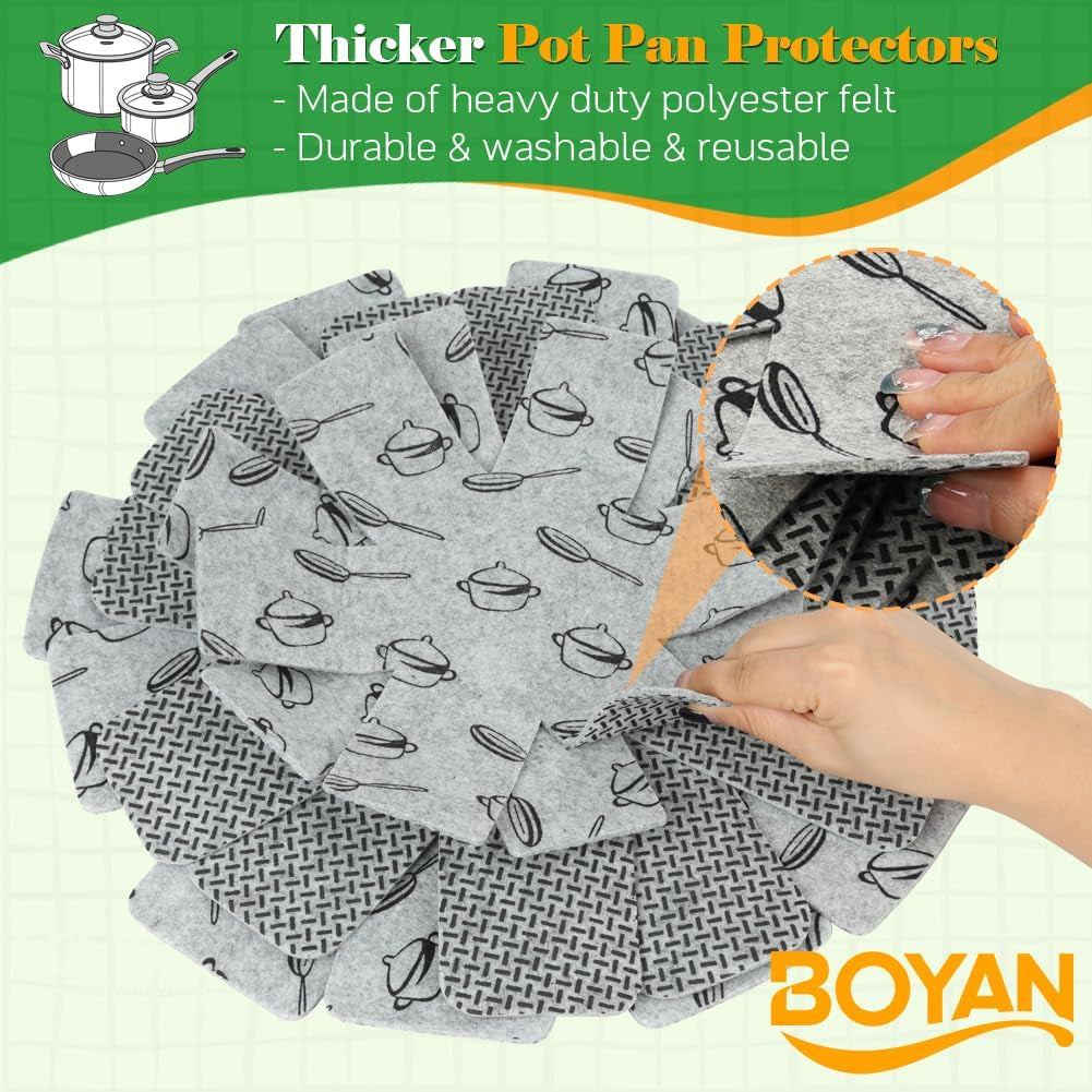 Set of felt pot and pan protectors placed between stacked cookware.