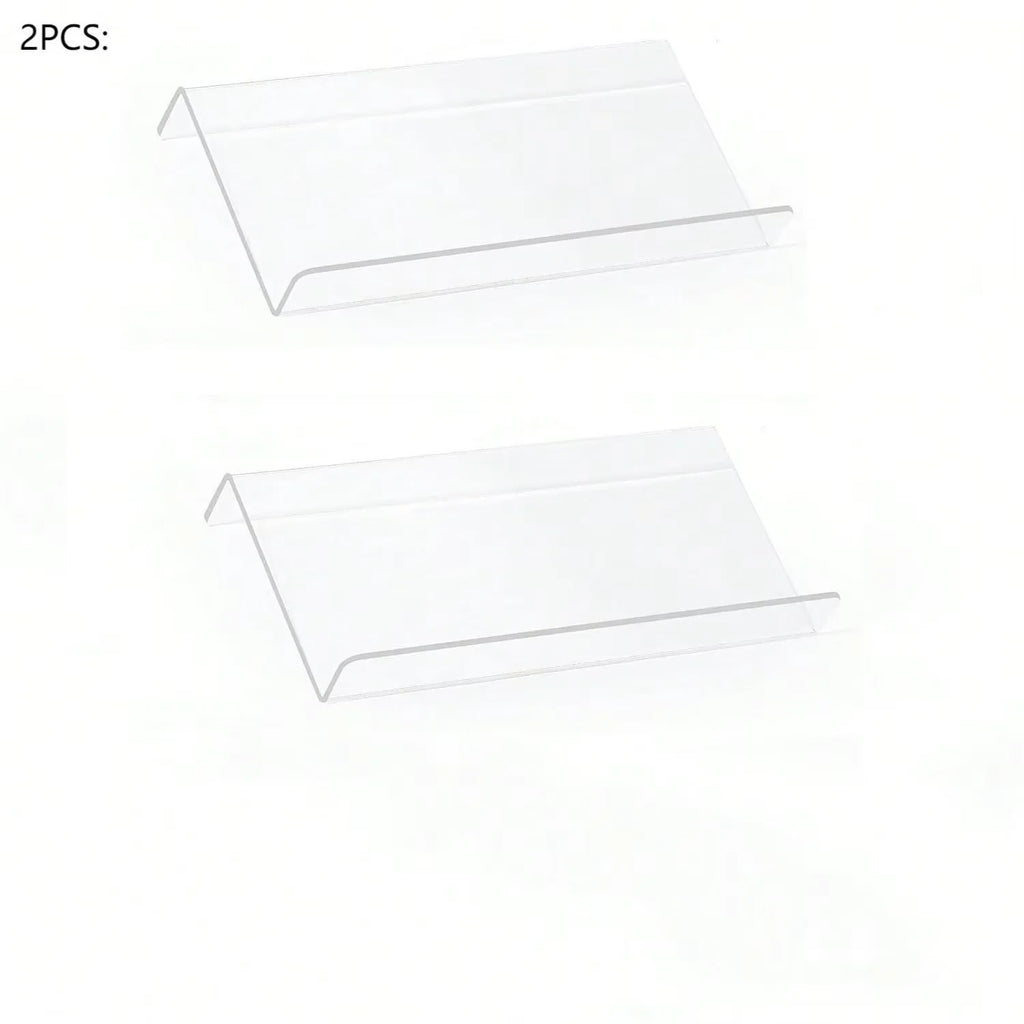 Adjustable acrylic spice organizer tray inside an open kitchen drawer holding spice jars at an angle.