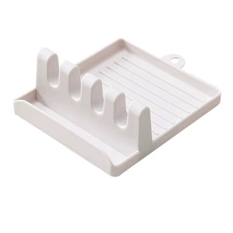 Non-slip kitchen utensil holder resting a spoon and spatula on a countertop.