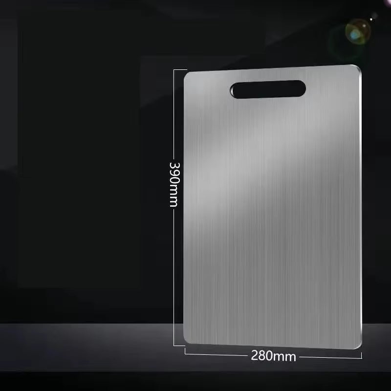 Stainless steel antibacterial cutting board on a kitchen counter with sliced vegetables.
