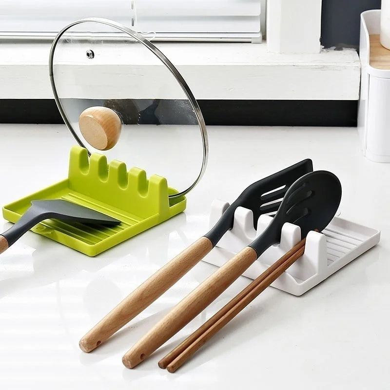 Non-slip kitchen utensil holder resting a spoon and spatula on a countertop.