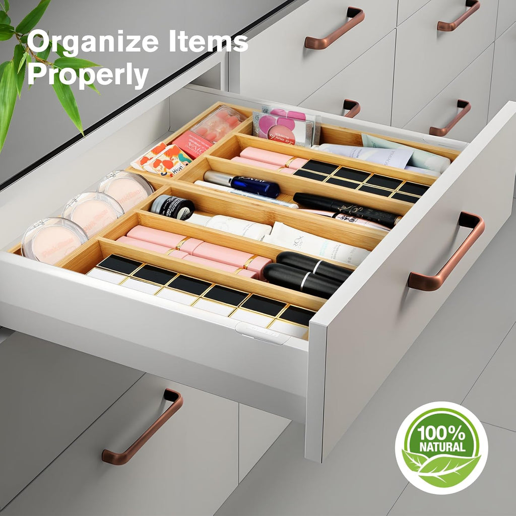 Bamboo silverware drawer organizer holding neatly divided spoons, forks, and knives.