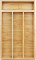 Bamboo silverware drawer organizer holding neatly divided spoons, forks, and knives.