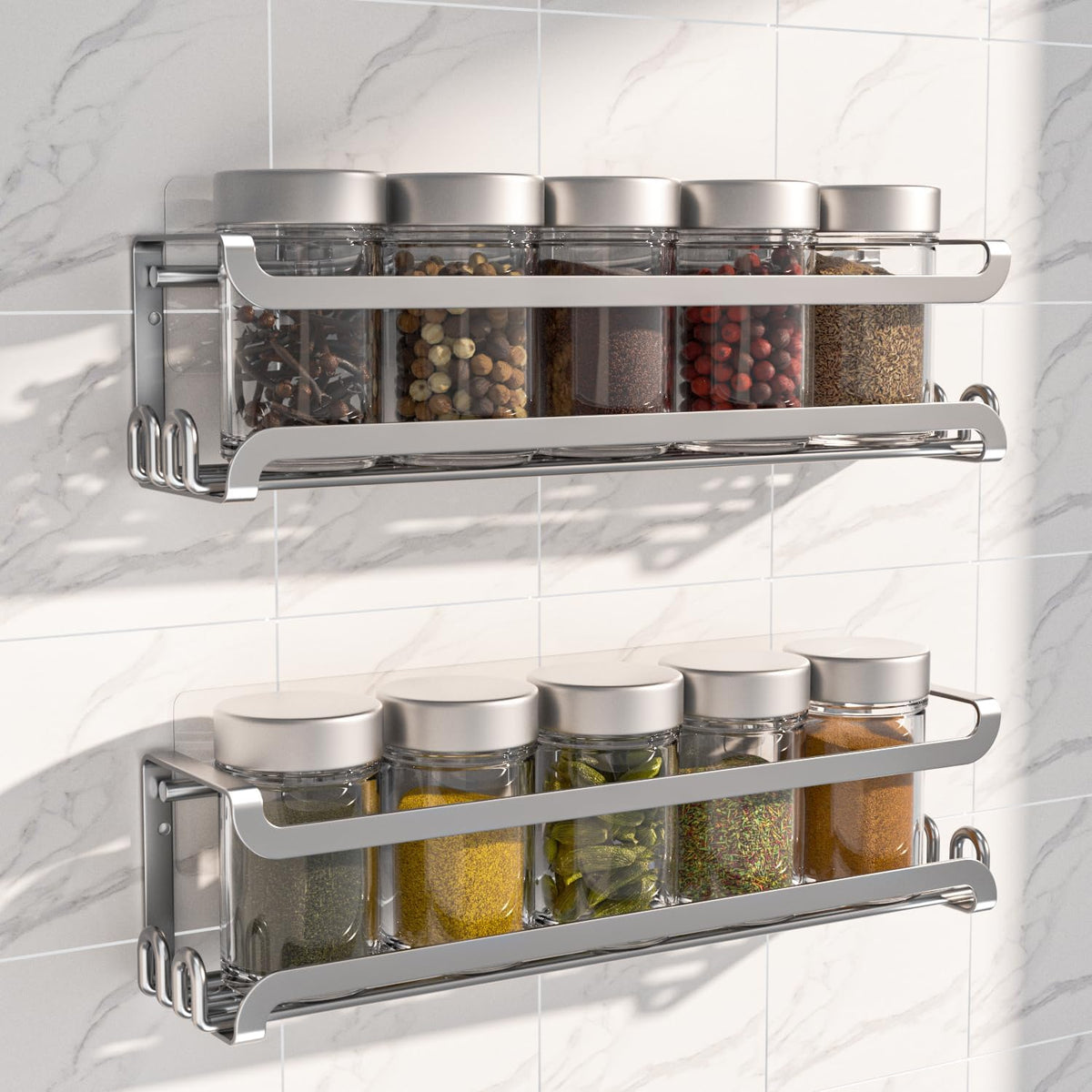 Silver wall-mounted spice rack with metal hooks mounted inside a pantry door.