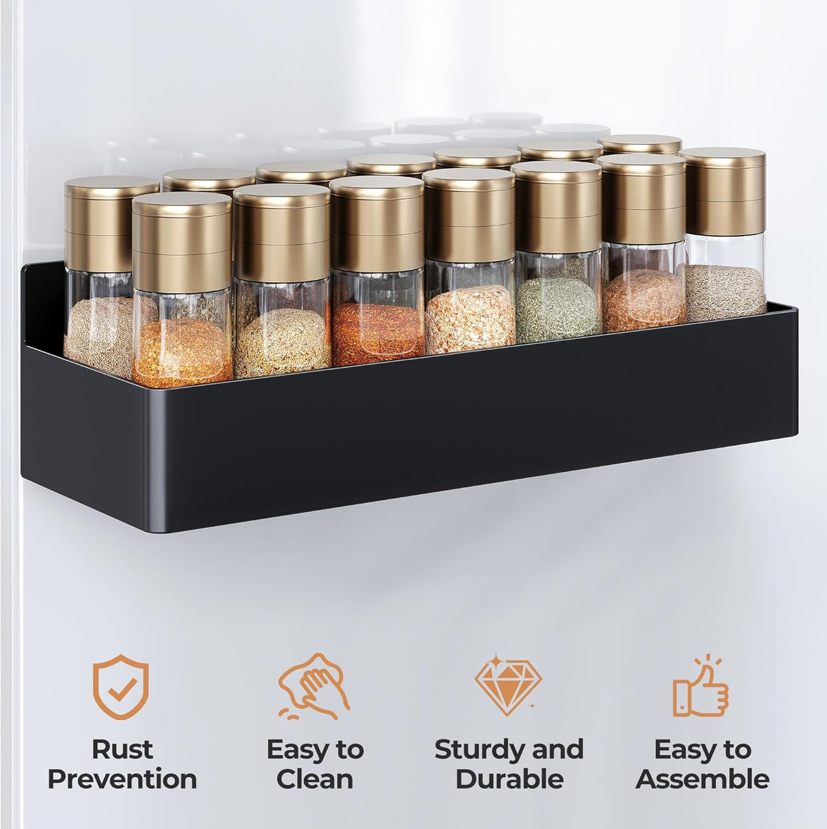 Magnetic spice rack mounted on the side of a refrigerator holding spice jars.