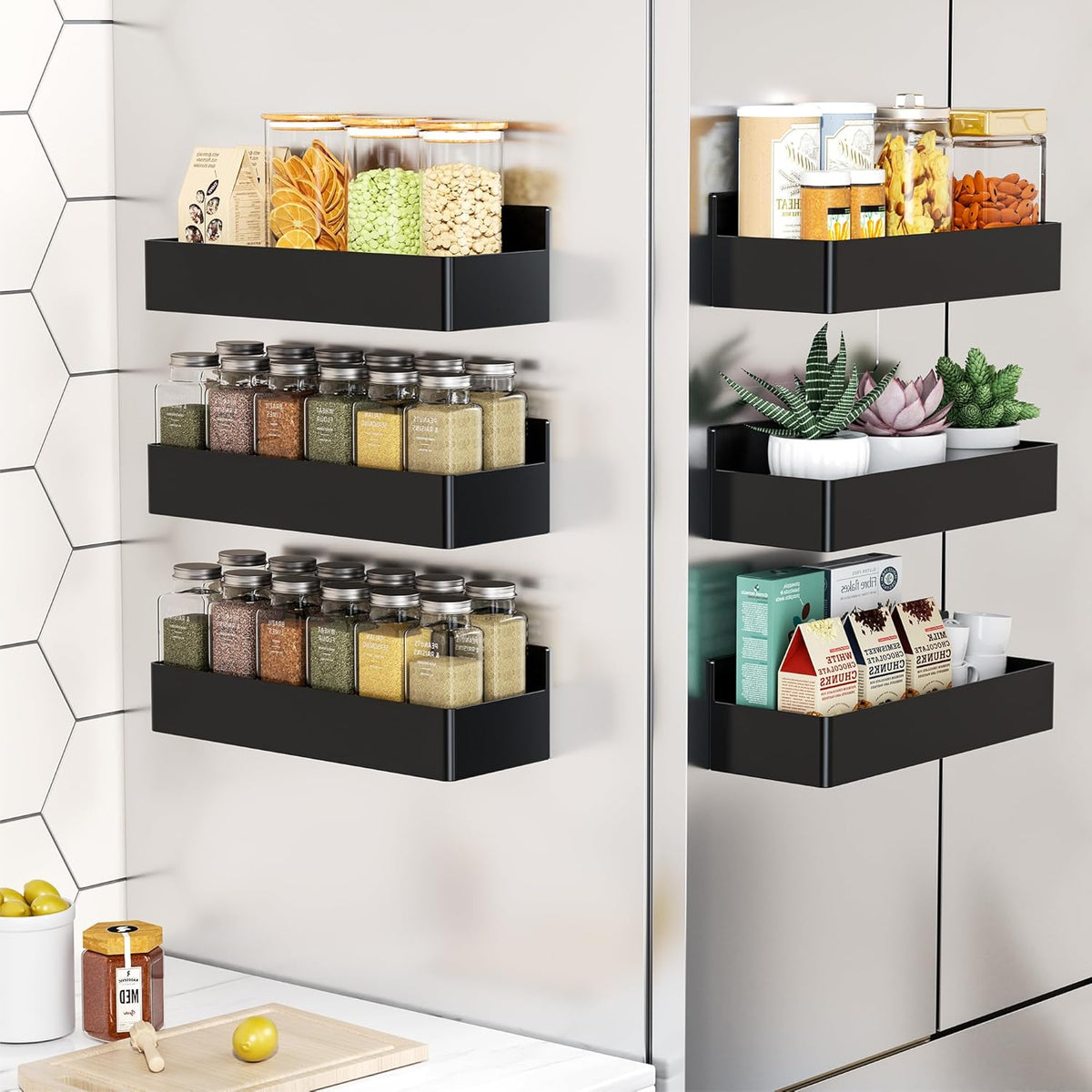 Magnetic spice rack mounted on the side of a refrigerator holding spice jars.