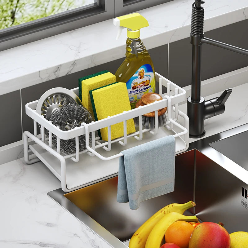 Tap-mounted sink shelf with drainage holes holding a sponge and dish soap.
