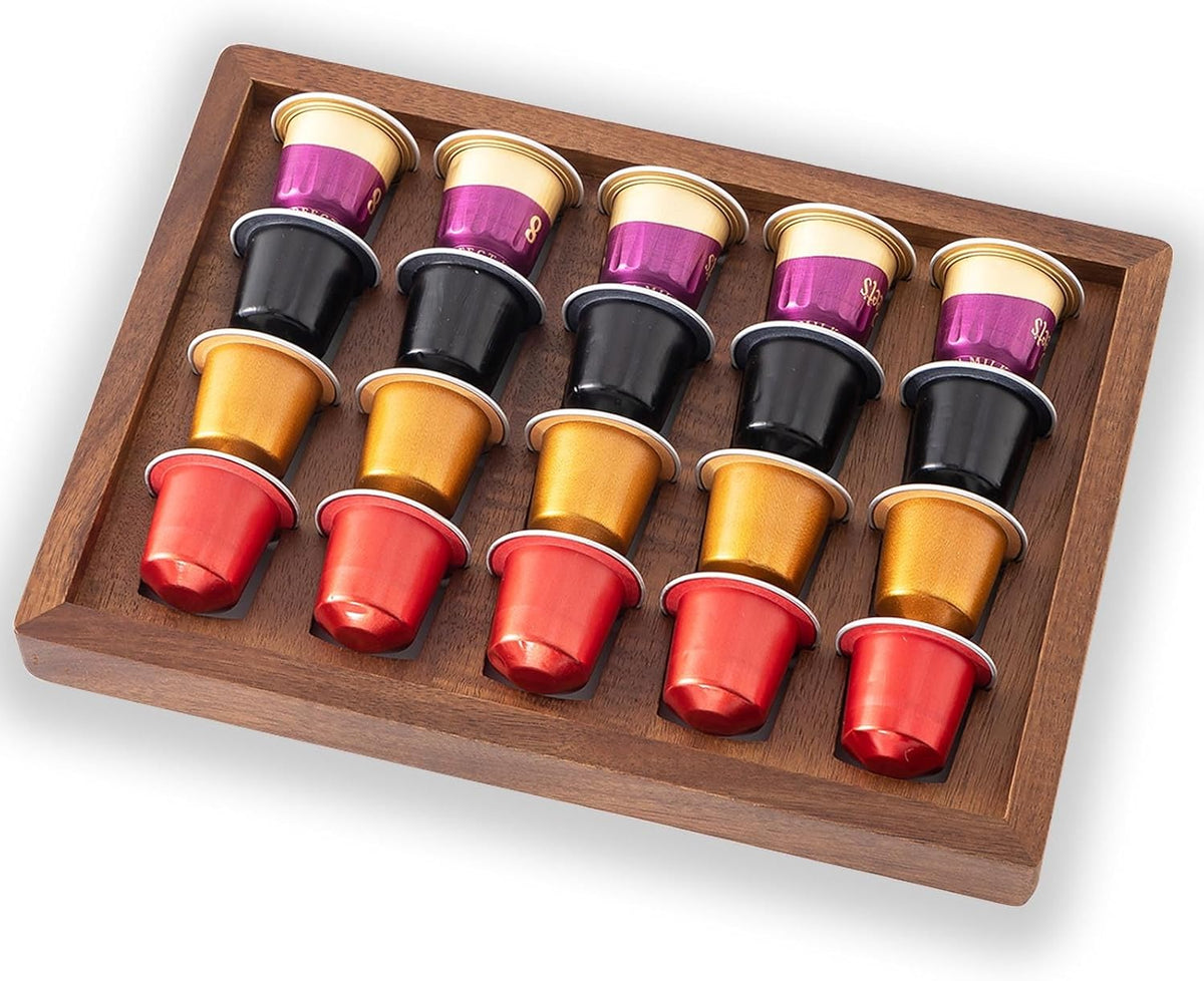 Two acacia wood coffee pod holder trays displayed on a kitchen countertop coffee bar.