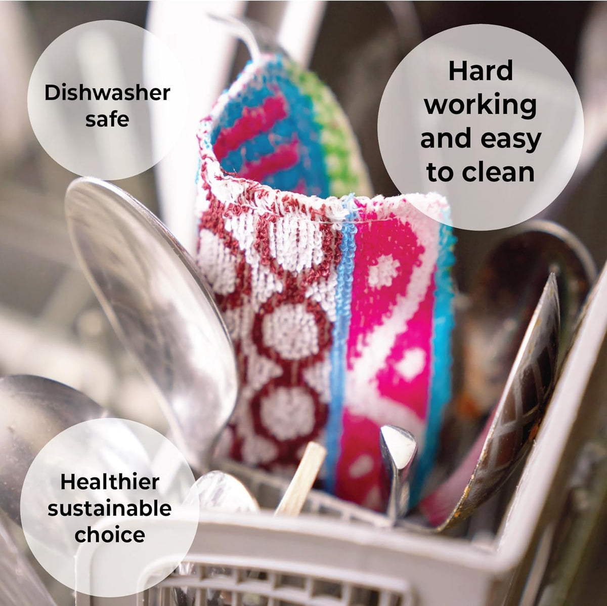 Set of four reusable non-scratch dish scrubbers in assorted colors on a kitchen counter.