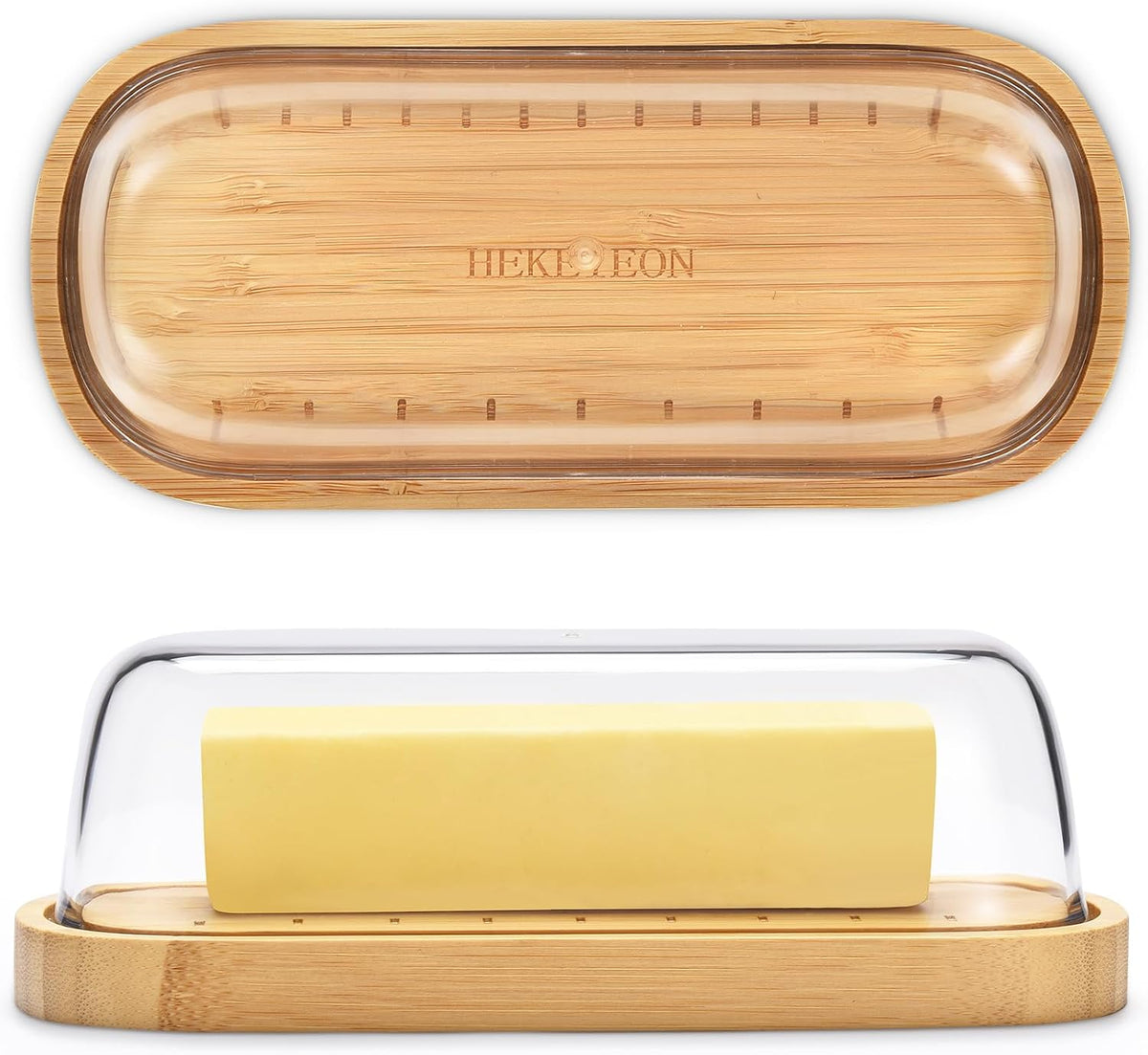 Bamboo butter dish with lid holding a stick of butter on a kitchen counter.