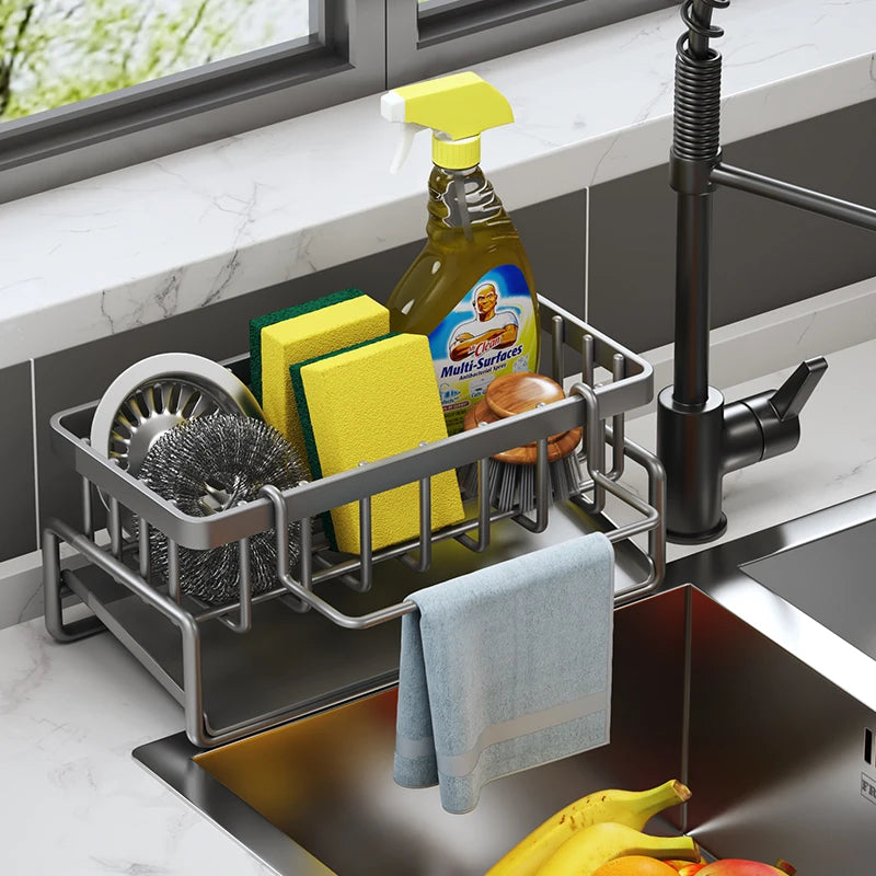 Tap-mounted sink shelf with drainage holes holding a sponge and dish soap.
