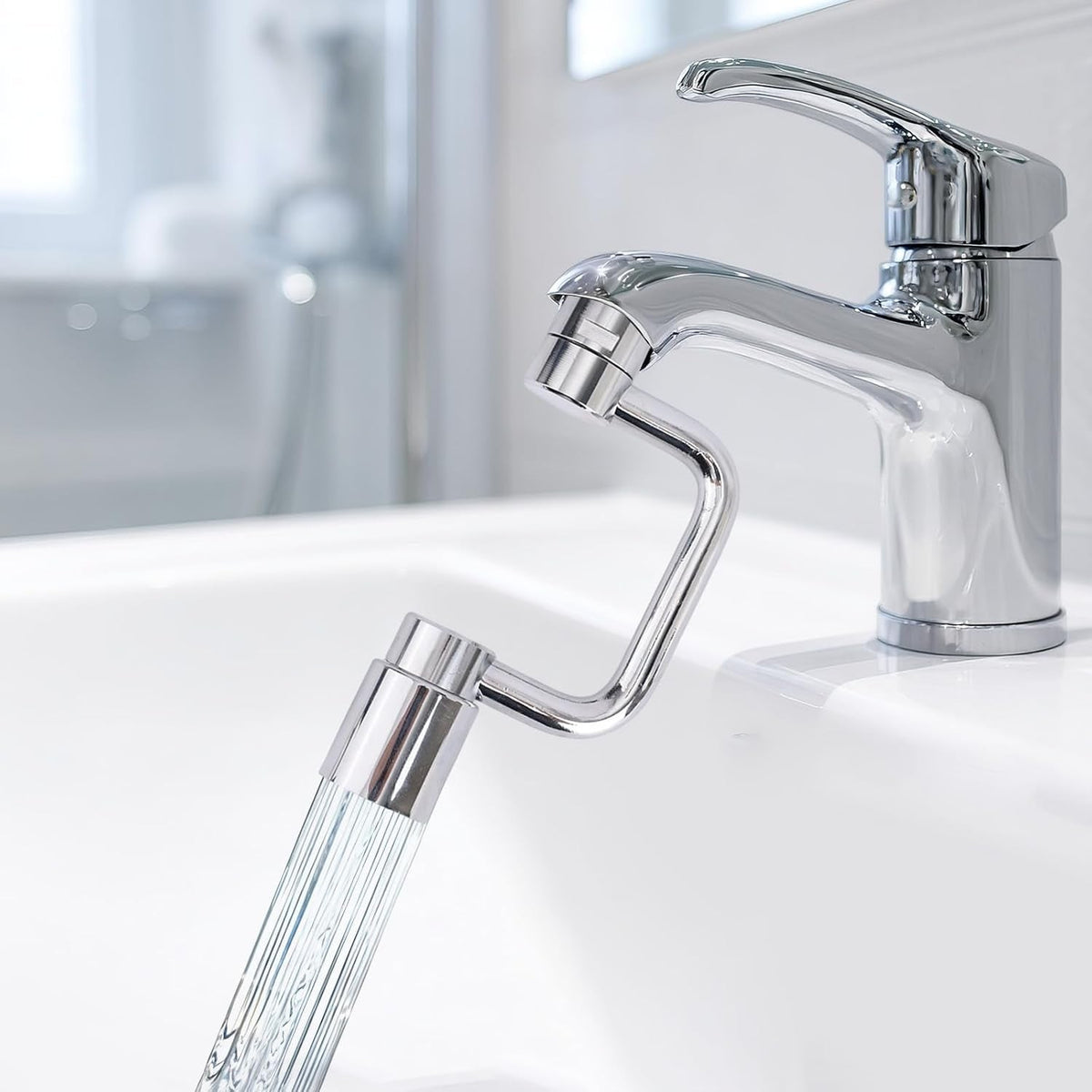 U-shaped faucet extender attached to a bathroom sink faucet at an angle.