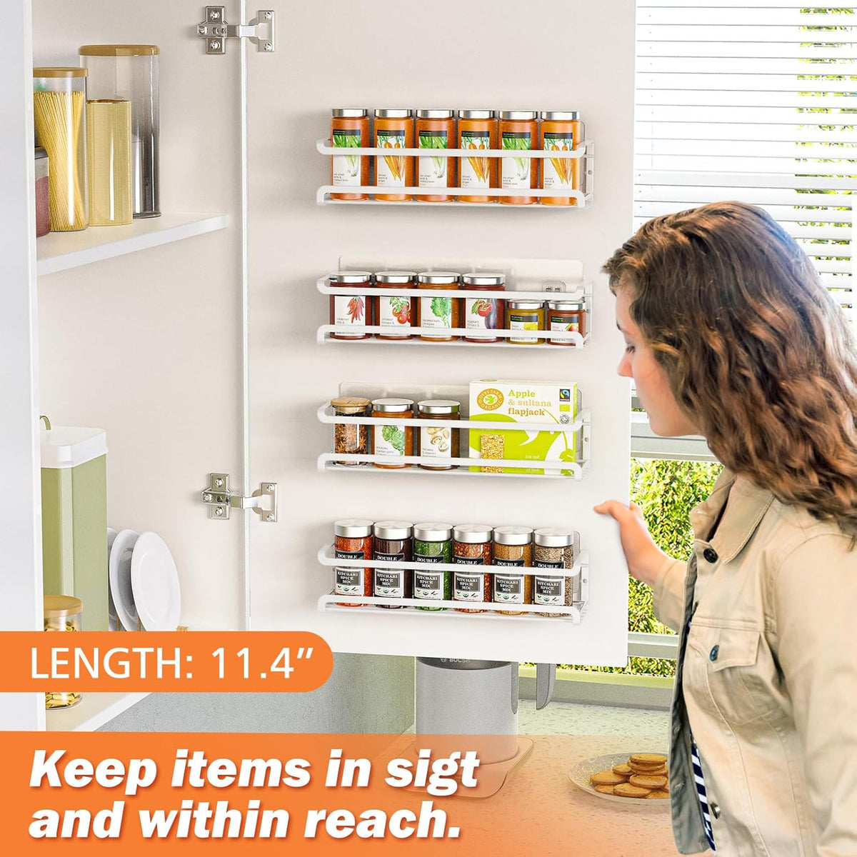 White wall-mounted spice rack holding spice jars inside a kitchen cabinet door.