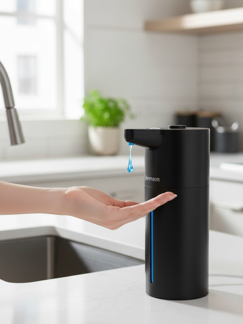 Simpson touchless automatic soap dispenser in matte black with blue LED light dispensing soap into a hand in a kitchen