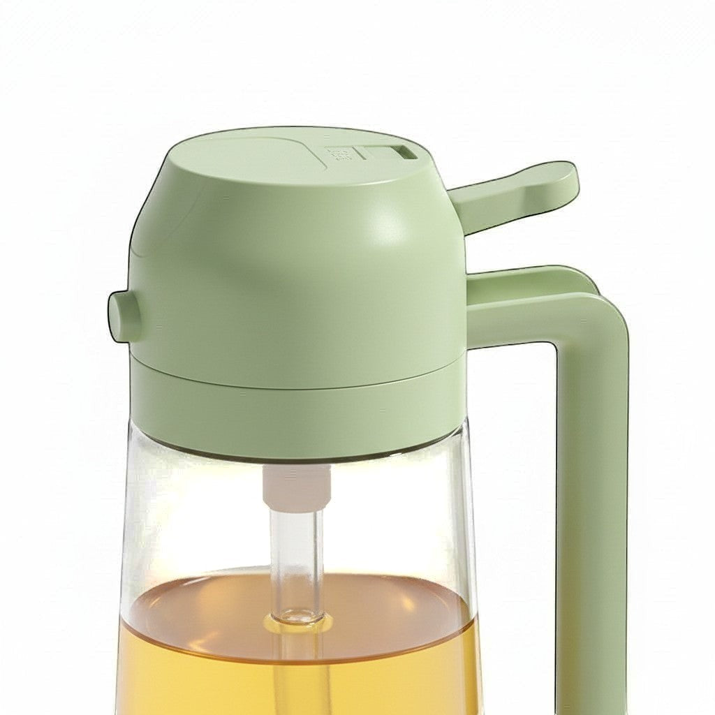 Simpson 2-in-1 olive oil spray and pour bottle in sage green with a clear glass base and ergonomic handle