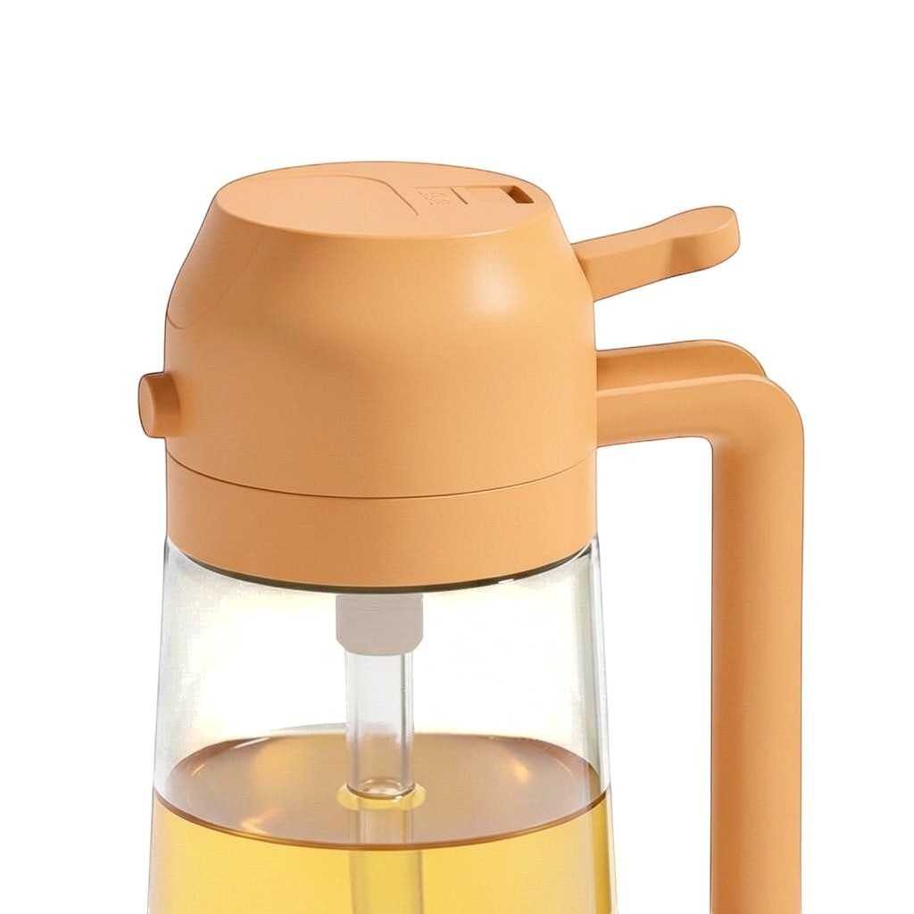 Simpson 2-in-1 olive oil spray and pour bottle in peach with a clear glass base and ergonomic handle
