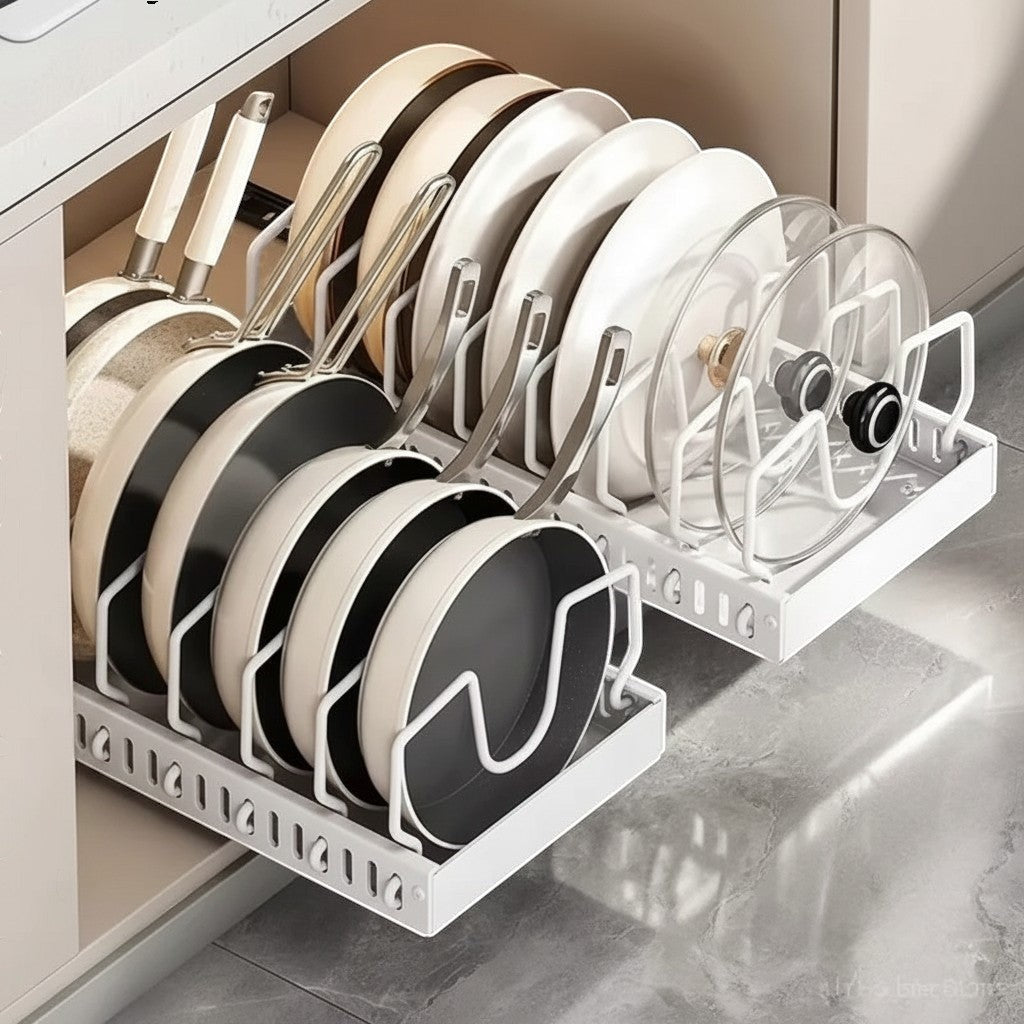 Simpson white pull-out cabinet organizer holding various pots, pans, and lids in adjustable carbon steel slots.